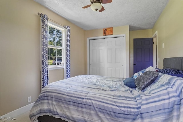 13774 Smith Goshen Rd, Beloit, OH 44609 - bedroom featuring a textured ceiling, a closet, and ceiling fan
