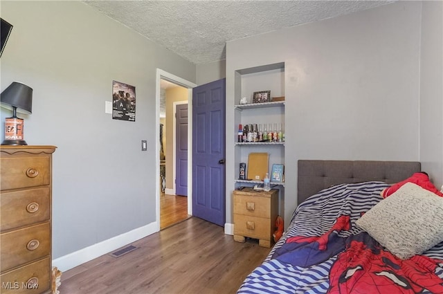 13774 Smith Goshen Rd, Beloit, OH 44609 - bedroom with wood finished floors and a textured ceiling