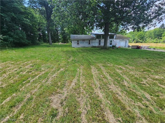 1070 US Highway 6, Rome, OH 44085 - view of green lawn with a garage