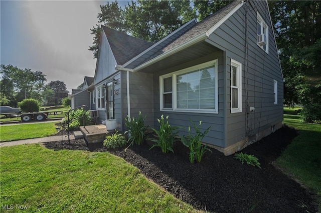 1819 49th St NW, Canton, OH 44709 - view of side of home featuring a lawn and a shingled roof