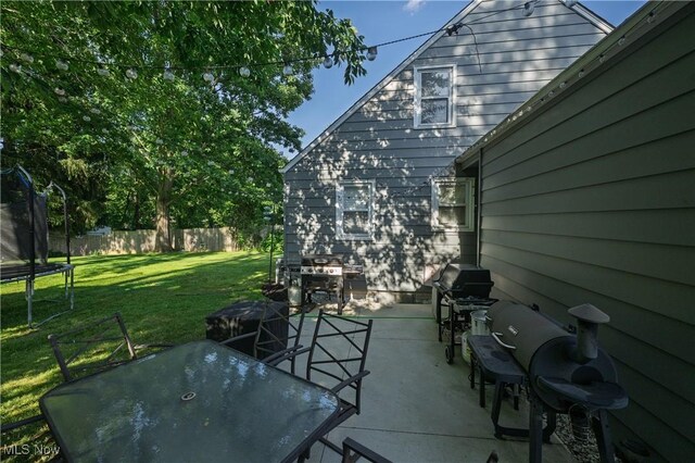 1819 49th St NW, Canton, OH 44709 - view of patio featuring a trampoline, area for grilling, and outdoor dining space