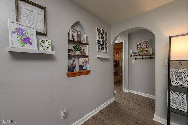 1819 49th St NW, Canton, OH 44709 - hallway with arched walkways and wood finished floors