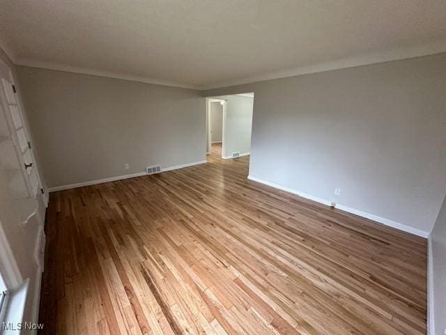4206 Verona Rd, South Euclid, OH 44121 - spare room featuring wood finished floors and ornamental molding