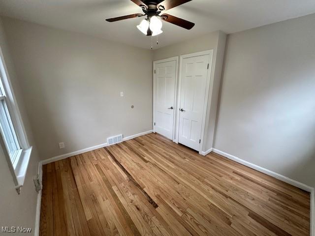 4206 Verona Rd, South Euclid, OH 44121 - unfurnished bedroom featuring light wood-style floors and ceiling fan