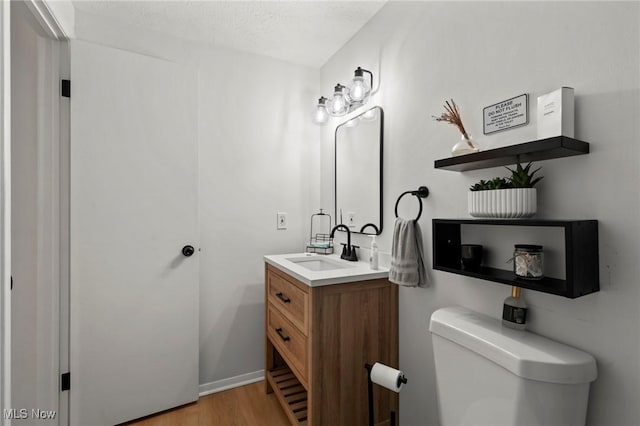 26749 Lake Of The Falls Blvd, Olmsted Falls, OH 44138 - bathroom featuring vanity, wood finished floors, and a textured ceiling