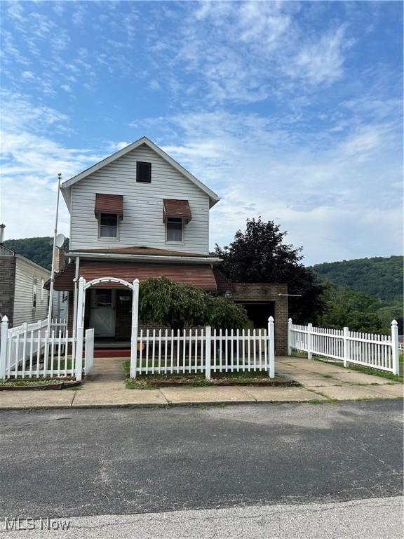 202 Grant St, Newell, WV 26050 - traditional home with a fenced front yard