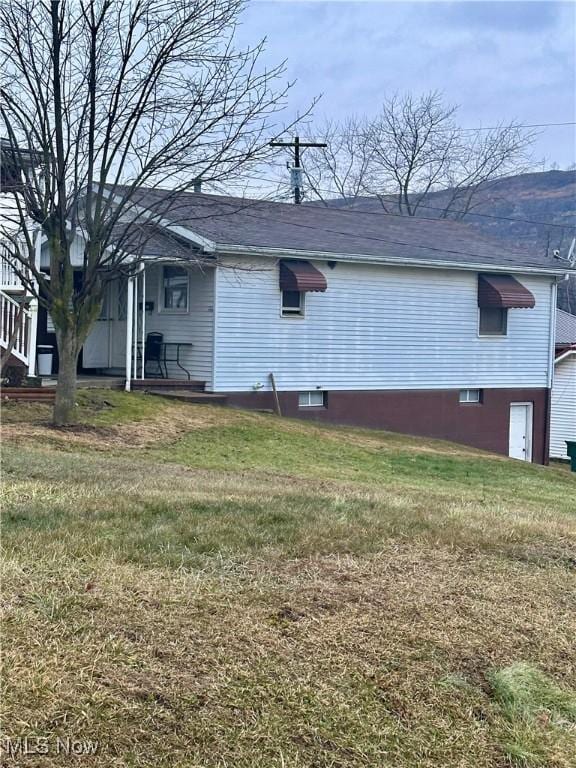202 Grant St, Newell, WV 26050 - view of side of property featuring a lawn and a shingled roof