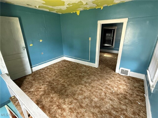 2013 7th St NE, Canton, OH 44704 - spare room with baseboards and carpet floors