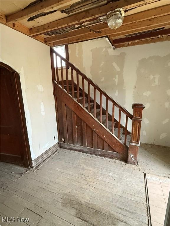 2013 7th St NE, Canton, OH 44704 - stairs featuring hardwood / wood-style flooring