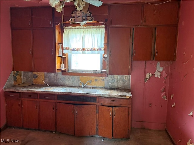 2013 7th St NE, Canton, OH 44704 - kitchen with decorative backsplash, unfinished concrete floors, tile countertops, and ceiling fan