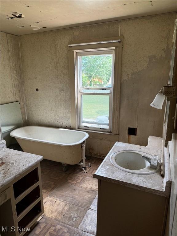 2013 7th St NE, Canton, OH 44704 - full bath featuring vanity and a freestanding tub