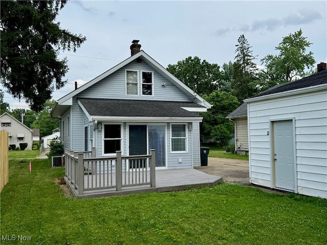 1104 Kenmore Ave SE, Warren, OH 44484 - rear view of house featuring a chimney, a yard, and a shingled roof