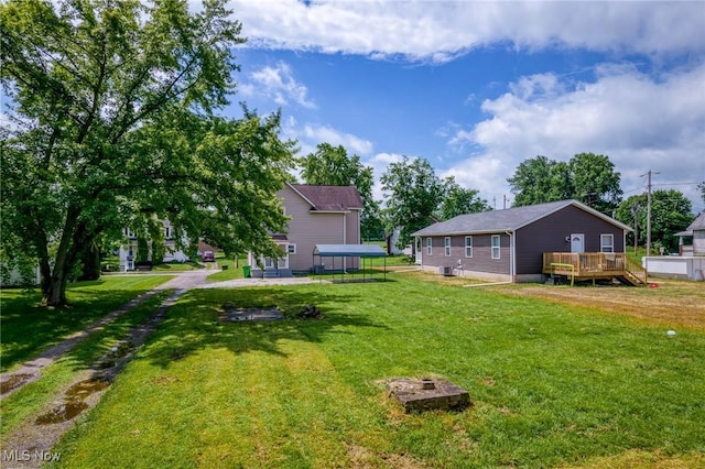 1014 Noble St E, Alliance, OH 44601 - view of green lawn featuring a deck