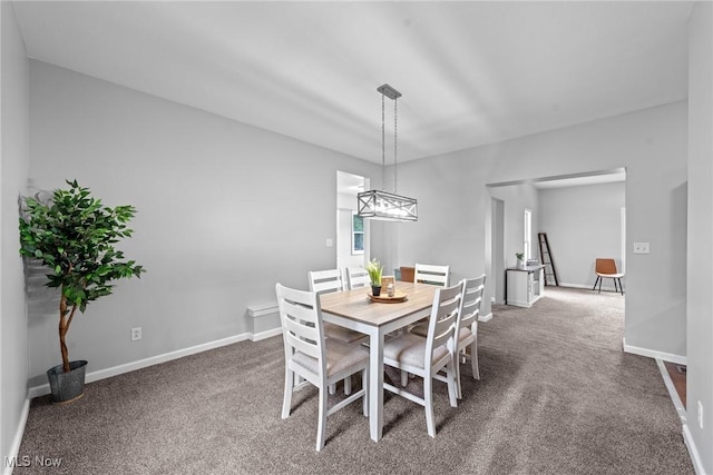 1014 Noble St E, Alliance, OH 44601 - dining space featuring carpet flooring and a chandelier
