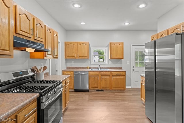 1014 Noble St E, Alliance, OH 44601 - kitchen with appliances with stainless steel finishes, under cabinet range hood, light wood-type flooring, and recessed lighting