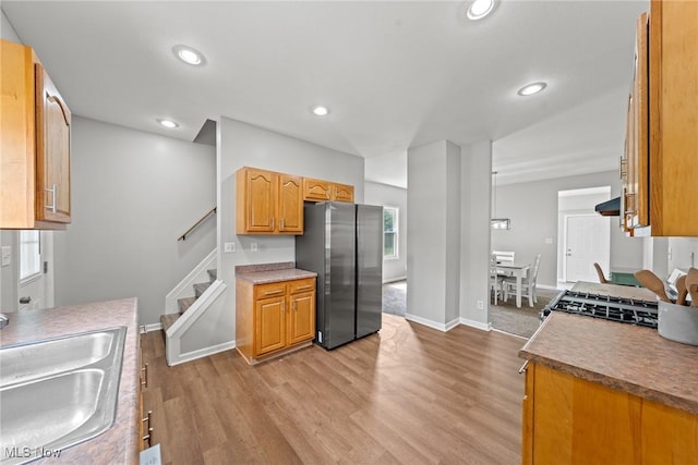 1014 Noble St E, Alliance, OH 44601 - kitchen featuring freestanding refrigerator, light wood-style floors, recessed lighting, and stove