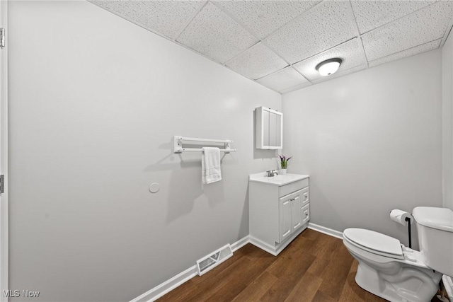 1014 Noble St E, Alliance, OH 44601 - bathroom with a drop ceiling, vanity, and wood finished floors