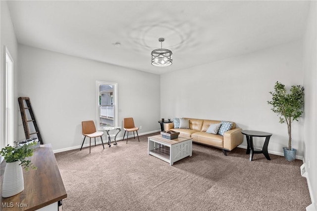 1014 Noble St E, Alliance, OH 44601 - carpeted living room featuring healthy amount of natural light and a chandelier