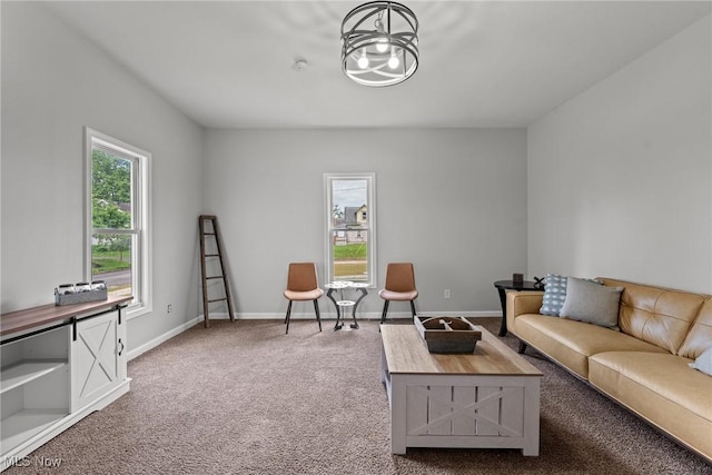 1014 Noble St E, Alliance, OH 44601 - carpeted living area with a chandelier and baseboards