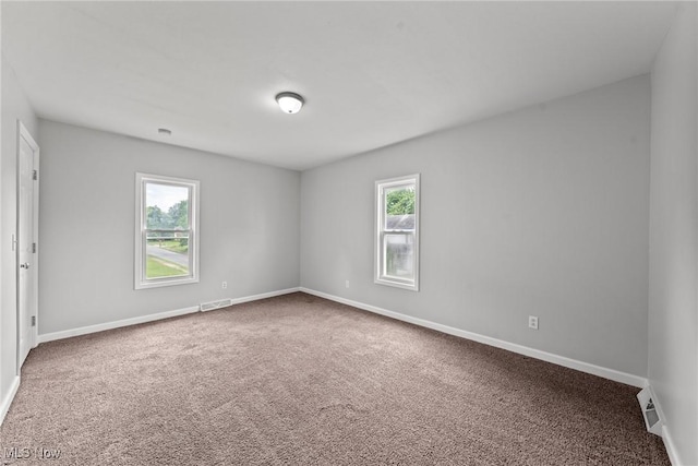 1014 Noble St E, Alliance, OH 44601 - carpeted empty room featuring baseboards