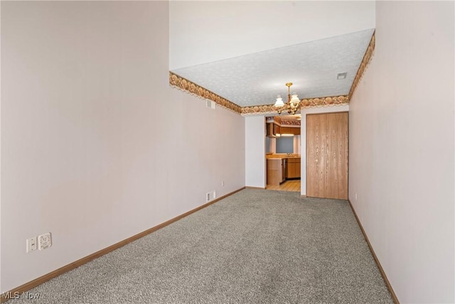 3494 Ivy Hill Cir Unit A, Cortland, OH 44410 - unfurnished room featuring a chandelier and light carpet