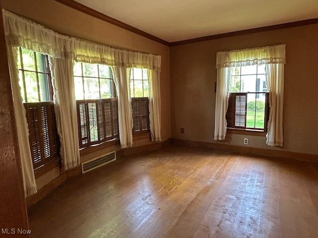 175 Curtis Dr, Avon Lake, OH 44012 - unfurnished room featuring ornamental molding and wood finished floors