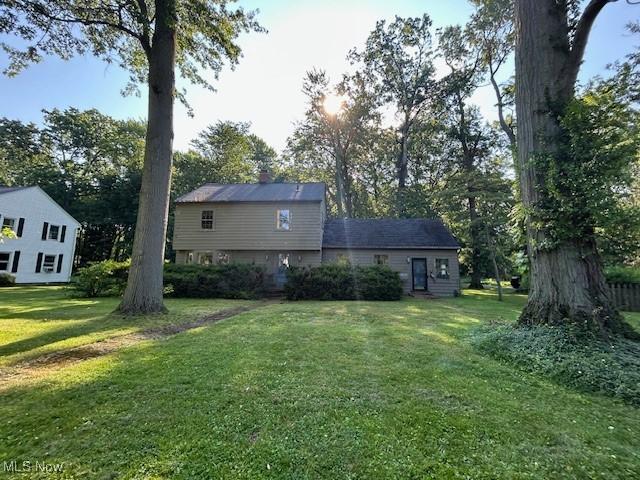 175 Curtis Dr, Avon Lake, OH 44012 - rear view of property with a yard