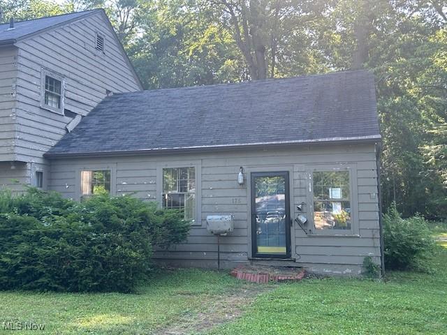 175 Curtis Dr, Avon Lake, OH 44012 - view of front of property with a front yard and a shingled roof