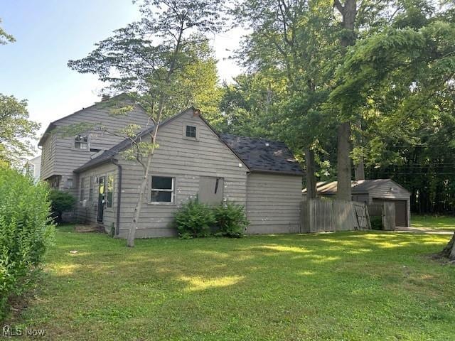 175 Curtis Dr, Avon Lake, OH 44012 - view of side of property featuring a lawn and a storage shed