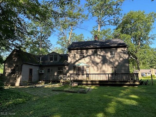 175 Curtis Dr, Avon Lake, OH 44012 - back of house with a lawn, a deck, and a chimney