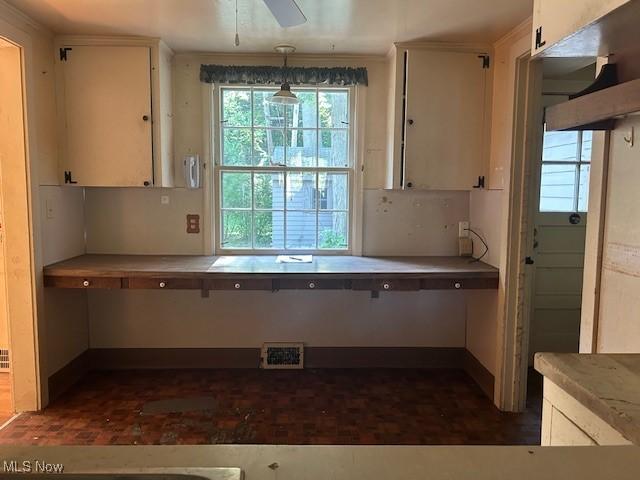 175 Curtis Dr, Avon Lake, OH 44012 - kitchen with white cabinetry, hanging light fixtures, a ceiling fan, and light countertops