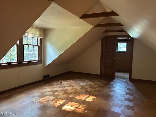 175 Curtis Dr, Avon Lake, OH 44012 - additional living space with baseboards and lofted ceiling