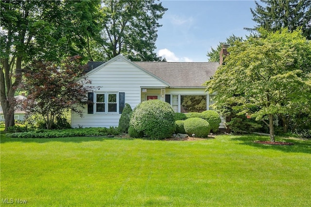 8298 Walter St NW, Massillon, OH 44646 - view of front facade featuring a front yard, a chimney, and roof with shingles