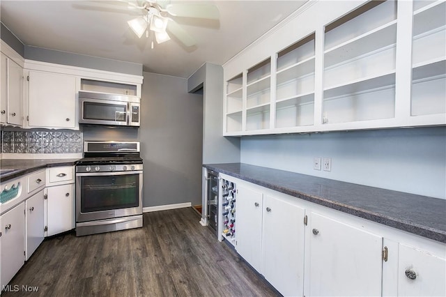 8298 Walter St NW, Massillon, OH 44646 - kitchen featuring appliances with stainless steel finishes, dark countertops, white cabinetry, open shelves, and a ceiling fan