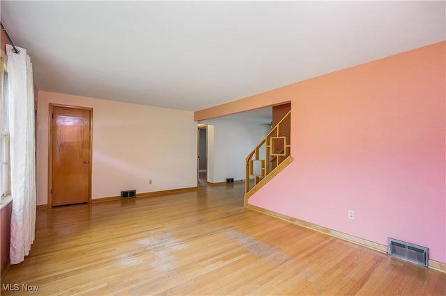 8298 Walter St NW, Massillon, OH 44646 - spare room with wood finished floors and stairway