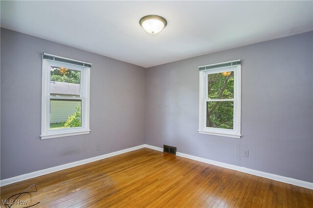 8298 Walter St NW, Massillon, OH 44646 - unfurnished room with plenty of natural light and wood-type flooring