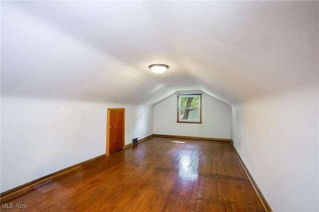 8298 Walter St NW, Massillon, OH 44646 - additional living space featuring vaulted ceiling and wood finished floors