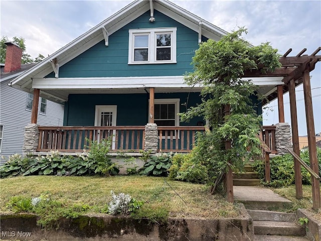 2000 16th St, Parkersburg, WV 26101 - view of front of house with covered porch, a pergola, and a front lawn