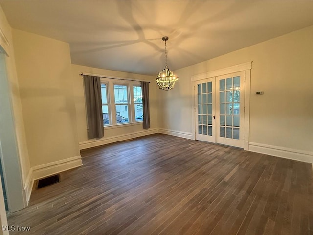 2000 16th St, Parkersburg, WV 26101 - unfurnished dining area featuring french doors, a chandelier, and dark wood-type flooring