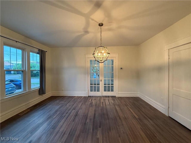 2000 16th St, Parkersburg, WV 26101 - unfurnished dining area with a chandelier, dark wood-type flooring, and french doors