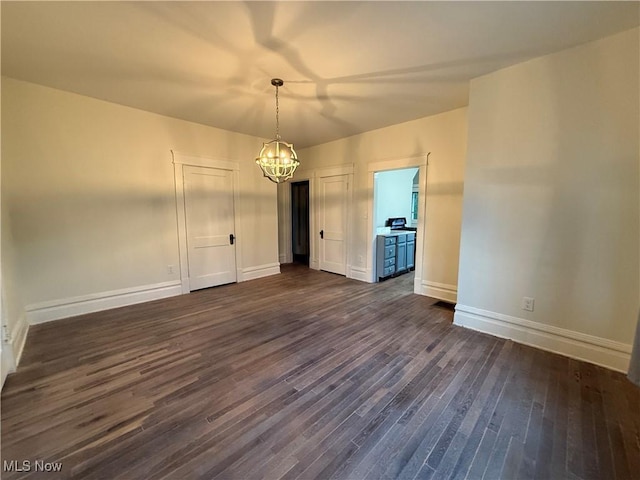 2000 16th St, Parkersburg, WV 26101 - empty room featuring a chandelier and dark wood finished floors