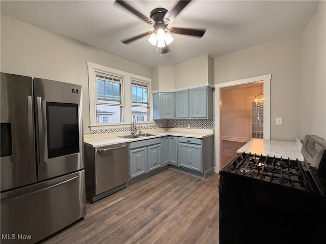 2000 16th St, Parkersburg, WV 26101 - kitchen with appliances with stainless steel finishes, gray cabinets, light countertops, dark wood-style floors, and ceiling fan