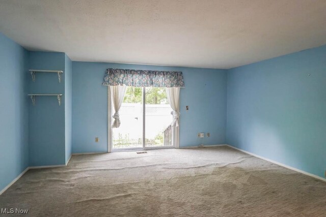 3888 Lake Run Blvd, Stow, OH 44224 - unfurnished bedroom featuring carpet flooring and access to outside