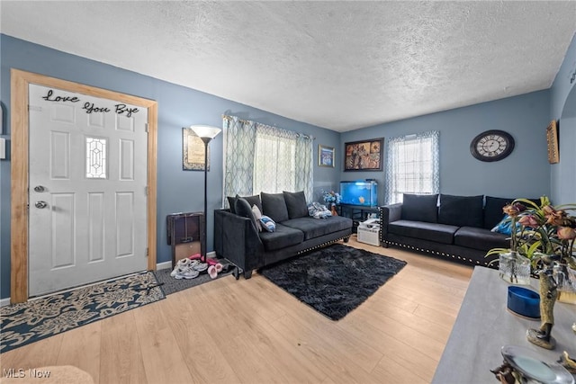 782 Ardella Ave, Akron, OH 44306 - living area with a textured ceiling and wood finished floors