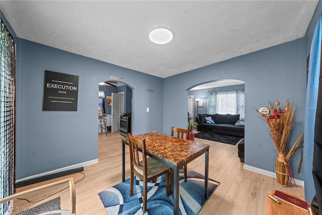 782 Ardella Ave, Akron, OH 44306 - dining room with arched walkways and wood finished floors