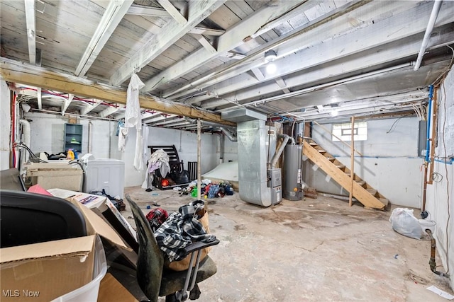 782 Ardella Ave, Akron, OH 44306 - basement featuring gas water heater, heating unit, stairway, and washer / clothes dryer
