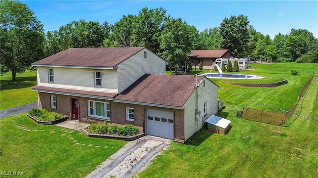 6414 Elk Rd, Canfield, OH 44406 - traditional home featuring asphalt driveway, a garage, and brick siding