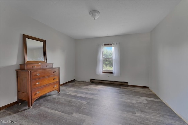 6414 Elk Rd, Canfield, OH 44406 - bedroom featuring a baseboard radiator and wood finished floors