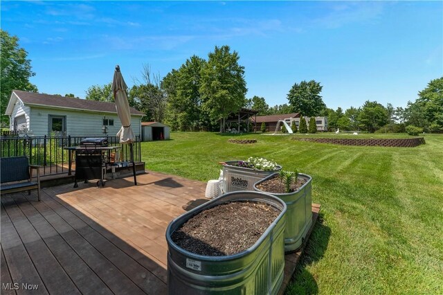 6414 Elk Rd, Canfield, OH 44406 - deck with a storage unit and a yard