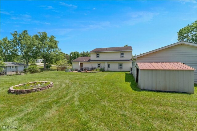 6414 Elk Rd, Canfield, OH 44406 - rear view of house featuring a lawn and an outdoor structure